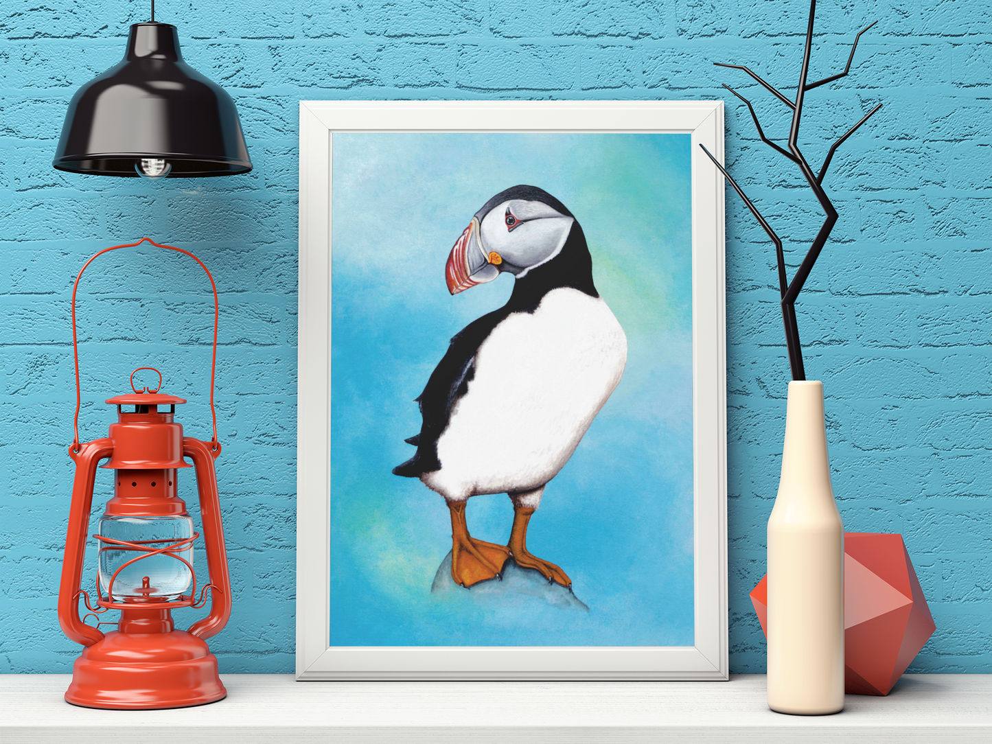 Mock Up of an Atlantic Puffin Art Print (featuring a full length puffin) in a white frame. Artwork by Jenny Pond, JPArtwork