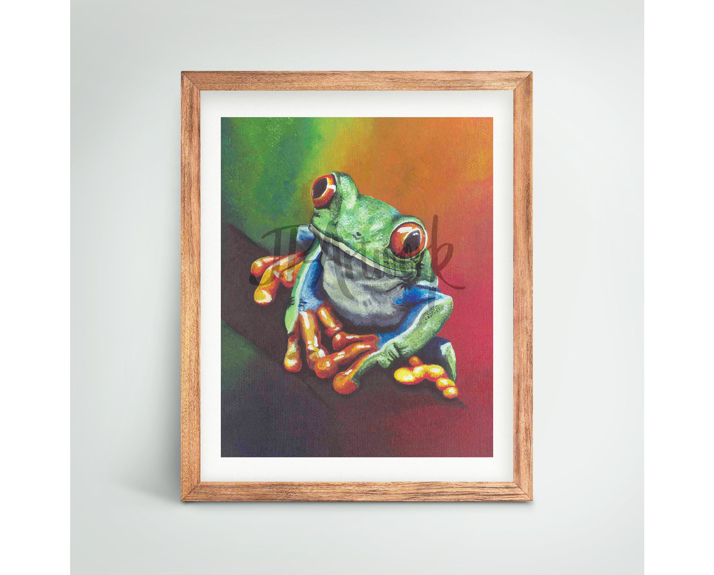 Mock Up of a Tree Frog Art Print (featuring a frog sitting on a branch) in a wood frame. Artwork by Jenny Pond, JP Artwork