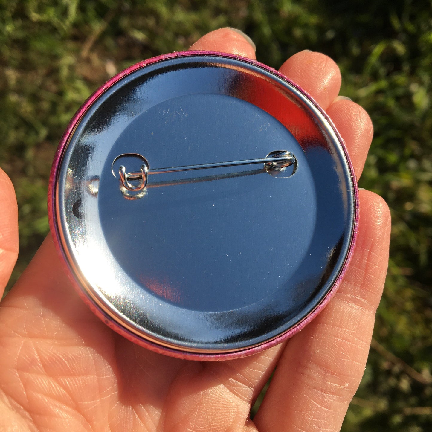 Photo shows the back of the large pin badge for those with weak immune systems. By Jenny Pond, JP Artwork