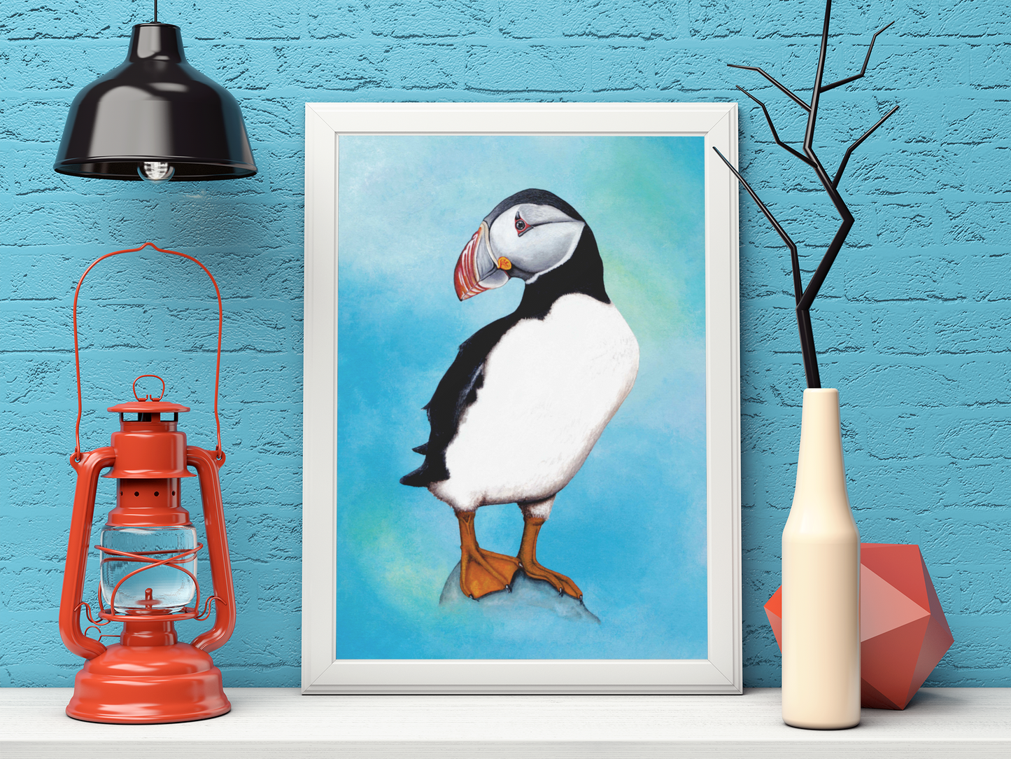 Mock Up of an Atlantic Puffin Art Print (featuring a full length puffin) in a white frame. Artwork by Jenny Pond, JPArtwork 